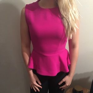 Fuchsia tank top with flared bottom. Perfect shape